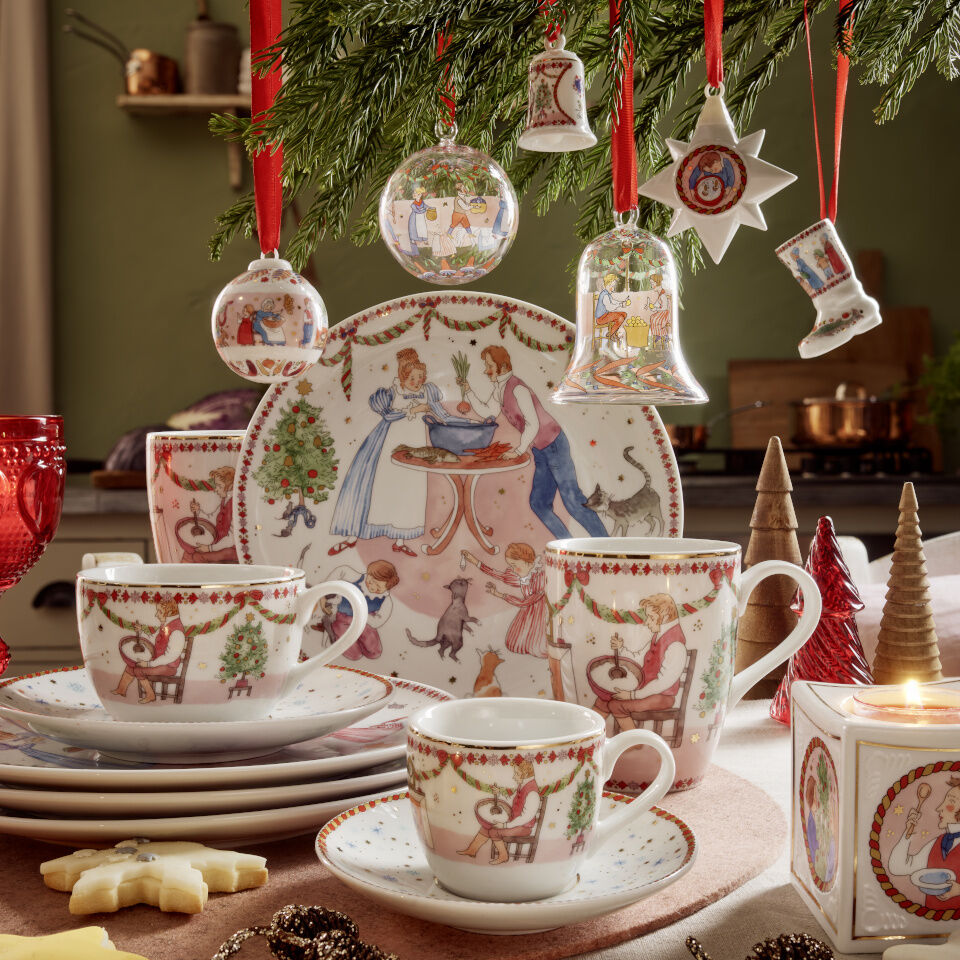 A scene with a bunch of Christmas decorations and tableware beautifully set up
