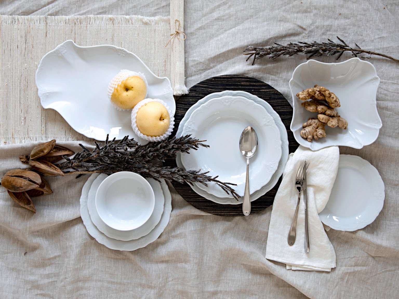 Hutschenreuther dining collection Baronesse white on linen tablecloth with apples, ginger, branches